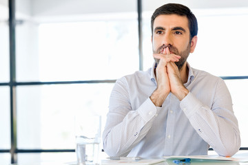 Wall Mural - Pensive businessman at office