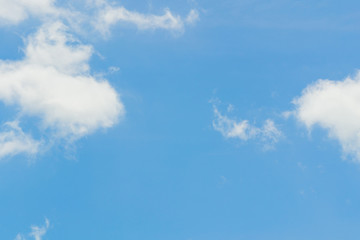 Wall Mural - Blue sky background with tiny clouds. White fluffy clouds in the blue sky