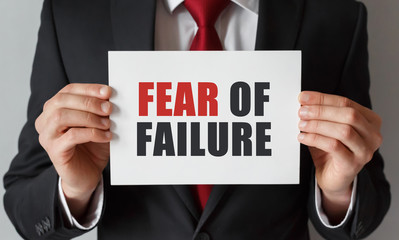 Aufkleber - Businessman holding a card with text Fear of Failure