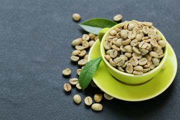 Wall Mural - natural organic green coffee beans on a black background