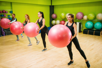 Wall Mural - Women group with big balls doing exercise, fitness