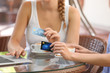 © Africa Studio - Women with laptop and credit cards in cafe