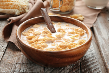 Canvas Print - Dish with cornflakes and milk on table