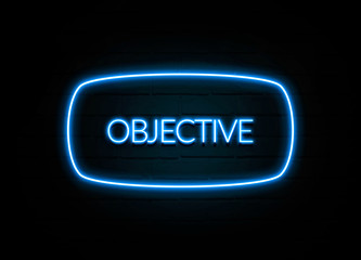 Objective  - colorful Neon Sign on brickwall