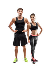 Sport, fitness, workout concept. Fit couple, strong muscular man and slim woman posing on a white background