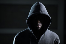 Mysterious African Man With Hood In Darkness