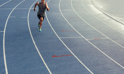 Wall Mural - sprinter running on track