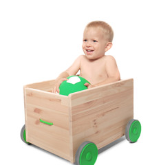 Cute little baby in wooden cart, isolated on white