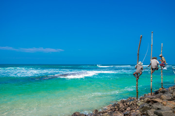 Fisherman stilt fishing beautiful Indian ocean