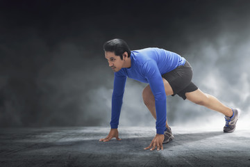 Poster - Muscular asian man ready for run