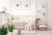 Baby Bedroom Decorated With Pictures Of Animals