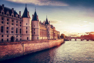 Wall Mural - Beautiful skyline of Paris, France, with Conciergerie, Pont Neuf at sunset. Colourful travel background. Romantic cityscape.