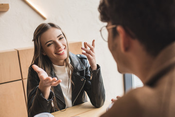 Wall Mural - couple talking in cafe