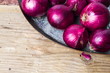 Purple onions on the metal plate