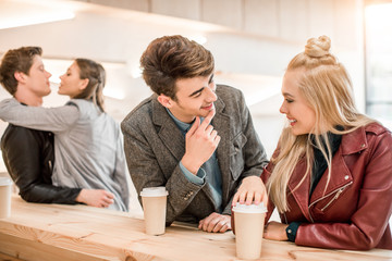 Wall Mural - Two heterosexual couples at bar