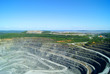 © Evgeny - RUSSIA, KACHKANAR - JUNE 18, 2016: extraction of bauxite by open method in the quarry of the Kachkanarsky ore mining and processing enterprise, Sverdlovsk region.