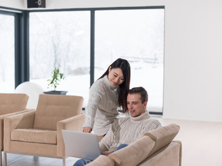 Wall Mural - multiethnic couple using laptop computers