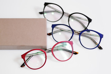 Wall Mural - Multicolored fashionable glasses with box on white background