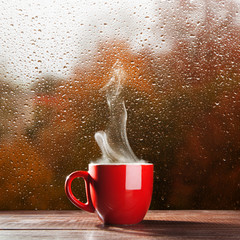 Wall Mural - Cup of coffee on a rainy day