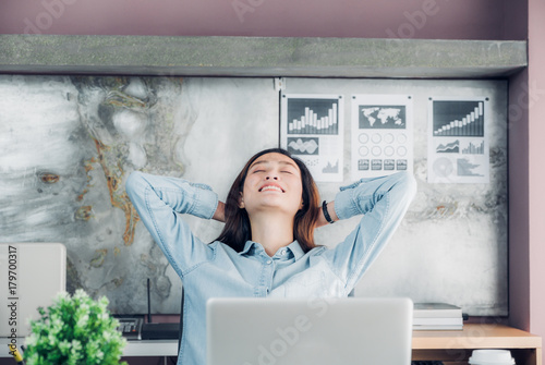 Asian Creative Designer Raise Arm And Rest At Back Of Head And