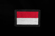 Monaco flag, Indonesia flag on black background.