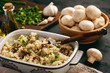 Vegetarian rice casserole with mushrooms, leek and garlic.