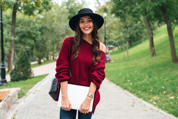 Sticker - Portrait of a casual smiling asian girl dressed in hat