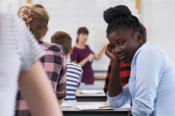 Wall Mural - portrait of bored teenage pupil in class