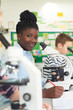 © highwaystarz - Group Of Pupils Using Microscopes In Science Class