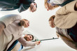 © Kzenon - Low-angle view of an international team working together during brainstorming session