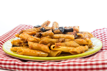 Wall Mural - Pasta with aubergine and tomato sauce on a the table