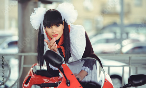 Beautiful Young Woman Hairstyle And Bows Outdoors With A