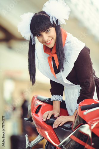 Beautiful Young Woman Hairstyle And Bows Outdoors With A