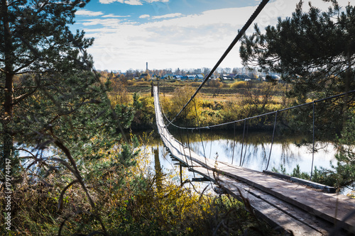 bridge-over-the-river-and-the-autumn-nature-around