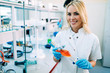 © NDABCREATIVITY - Attractive student of chemistry working in laboratory