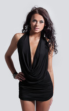 Confident Young Woman In A Black Dress