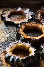 Caramelized Slices Of Acorn Squash On Baking Pan