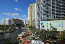 Aerial View Of Fort Lauderdale's Riverfront, Bustling With Boating Activity And Lined With High Rise Condos And Apartments Located In The Heart Of Downtown Fort Lauderdale.