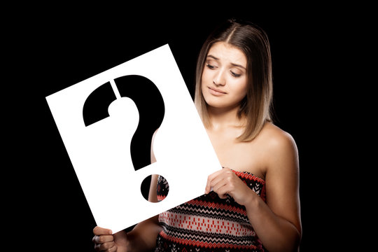 girl with a question mark sign