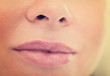 Close-up of woman's lips with natural lipstick make up. macro lipgloss make-up