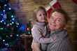 © Evgenia Tiplyashina - Dad and daughter at the Christmas tree