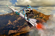 Conceptual image of biker flying up upwards on a rocket