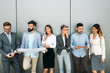 © NDABCREATIVITY - Group of perspective designers discussing in office