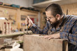 © 1001color - Wood designer working in workshop.