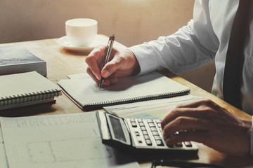 Poster - accountant working on desk office with using a calculator and pen, finance accounting concept