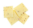 Top view of a group of fresh pepper jack cheese squares isolated on a white background.