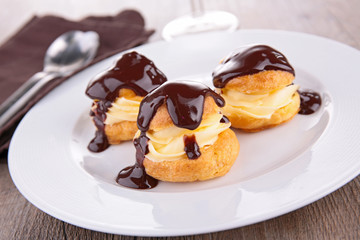 Wall Mural - profiterole, french puff pastry with cream and chocolate