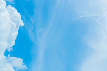 Wall Mural - Blue sky background with tiny clouds. White fluffy clouds in the blue sky