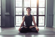 © uv_group - Young man meditates while practicing yoga in lotus pose. Freedom calmness and relax concept