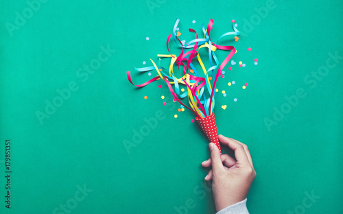 Fotografía Celebration,party backgrounds concepts ideas with hand holding colorful confetti,streamers